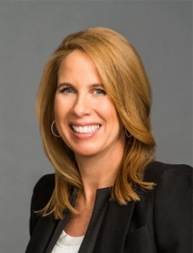 Female employee smiles for camera